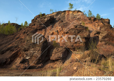 Waste heaps of red rock in industrial district Waste heaps of red rock in industrial district 23570260