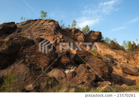 Waste heaps of red rock in industrial district Waste heaps of red rock in industrial district 23570261