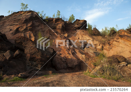 Waste heaps of red rock in industrial district Waste heaps of red rock in industrial district 23570264