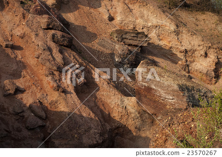 Waste heaps of red rock in industrial district Waste heaps of red rock in industrial district 23570267