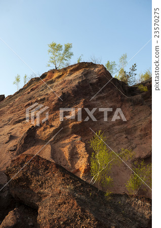 Waste heaps of red rock in industrial district Waste heaps of red rock in industrial district 23570275