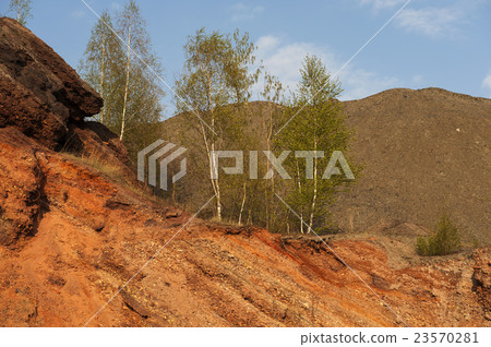 Waste heaps of red rock in industrial district Waste heaps of red rock in industrial district 23570281