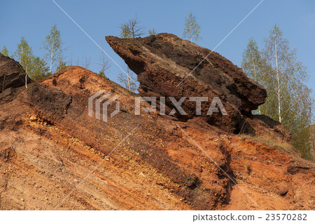 Waste heaps of red rock in industrial district Waste heaps of red rock in industrial district 23570282