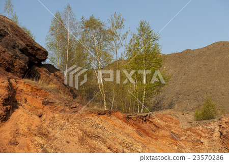 Waste heaps of red rock in industrial district Waste heaps of red rock in industrial district 23570286