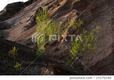 Waste heaps of red rock in industrial district Waste heaps of red rock in industrial district 23570288