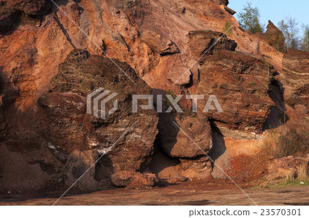 Waste heaps of red rock in industrial district Waste heaps of red rock in industrial district 23570301
