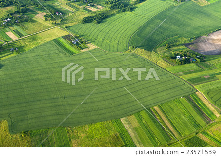 Aerial view on green fields and countryside Aerial view on green fields and countryside 23571539