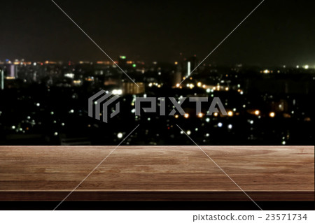 wood table top on night city background wood table top on night city background 23571734