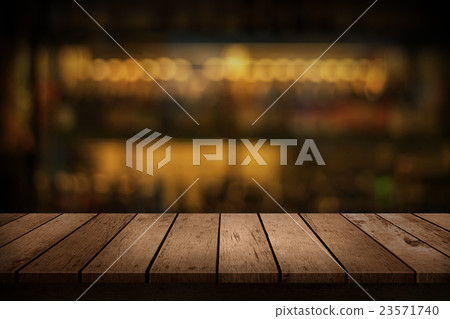 wooden table with a view of blurred beverages bar wooden table with a view of blurred beverages bar 23571740