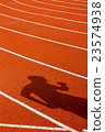 Shadow of man on red running track. Sport concept 23574938