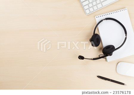 Office desk with headset and pc Office desk with headset and pc 23576178