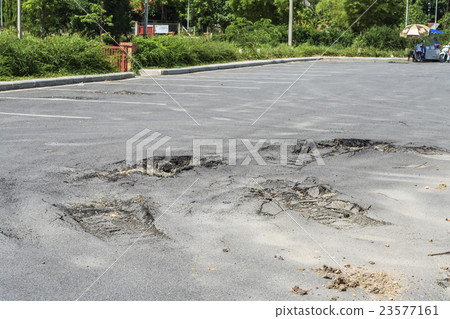 Asphalt on the car park was demolished due to poor 23577161