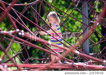 Child having fun on school yard playground 23578536