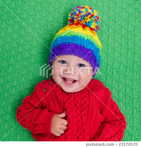 Little baby in warm knitted hat 23578570