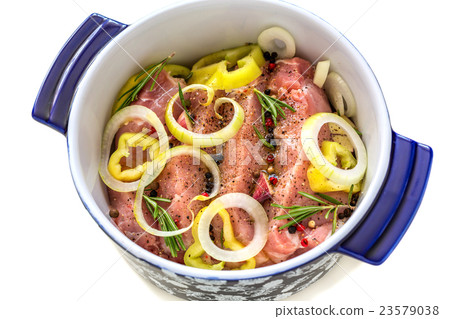 Casserole with marinated meat close-up. 23579038