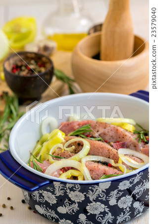 Meat in a pan with onions, spices and rosemary. Meat in a pan with onions, spices and rosemary. 23579040