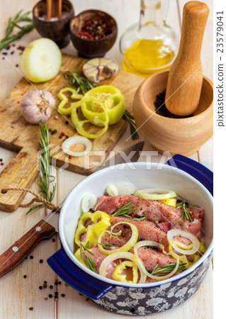 Preparing marinated meat roasting on the grill. Preparing marinated meat roasting on the grill. 23579041