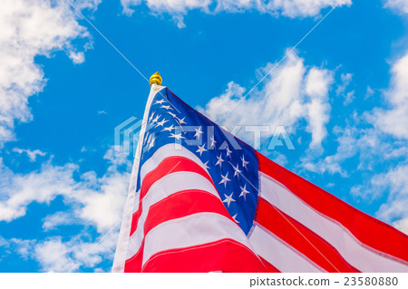 American flag on blue sky . 23580880
