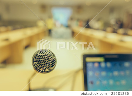Black microphone in conference room . ( Filtered image processed vintage effect. ) Black microphone in conference room . ( Filtered image processed vintage effect. ) 23581286