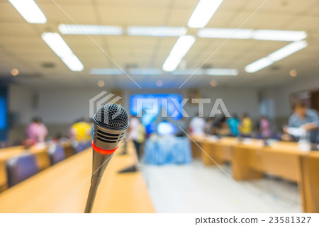 Black microphone in conference room . ( Filtered image processed vintage effect. ) Black microphone in conference room . ( Filtered image processed vintage effect. ) 23581327