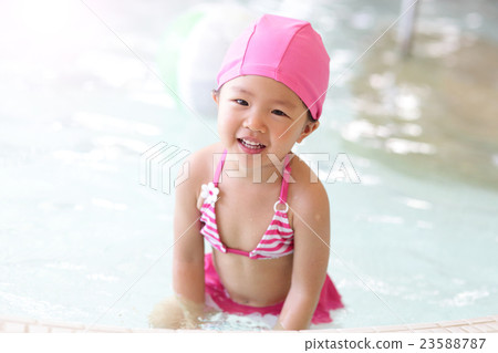 girl wear swimsuit play happily 23588787