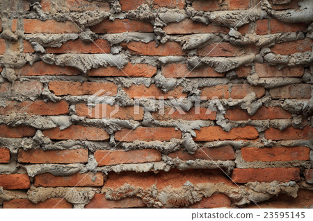 The old brick wall with overflow cement at edge. The old brick wall with overflow cement at edge. 23595145