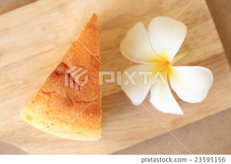 Japanese style Cheesecake, top view on wood plate. 23595156
