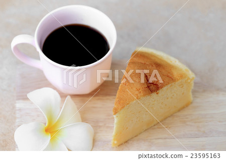 Japanese style Cheesecake and cup of black coffee. Japanese style Cheesecake and cup of black coffee. 23595163