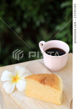 Japanese style Cheesecake and cup of black coffee. 23595165
