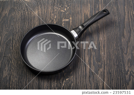 Frying pan on wooden Frying pan on wooden 23597531