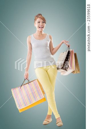Cheerful shopping woman 23599618