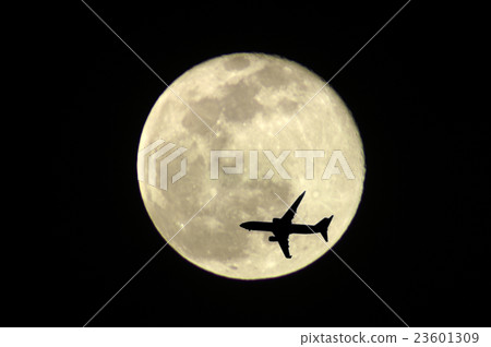 Full moon and jet aircraft 23601309