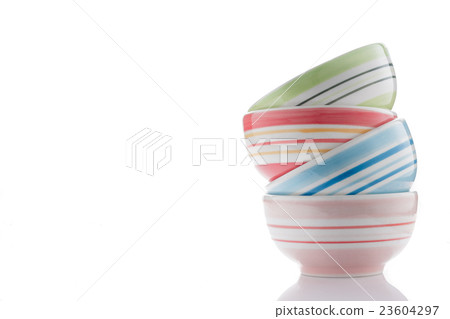 stack of colorful bowls  on white 23604297