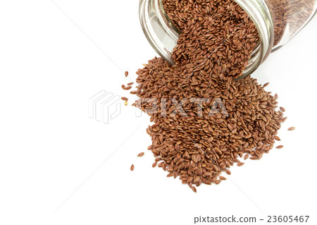 Heap of flaxseed in glass bottle 23605467