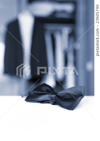 Bow tie. Open closet and tuxedo. Bow tie. Open closet and tuxedo. 23605740