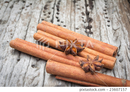Star anise and cinnamon on wood background Star anise and cinnamon on wood background 23607157