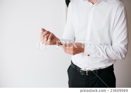 man buttons cuff-link on French cuffs sleeves man buttons cuff-link on French cuffs sleeves 23609989