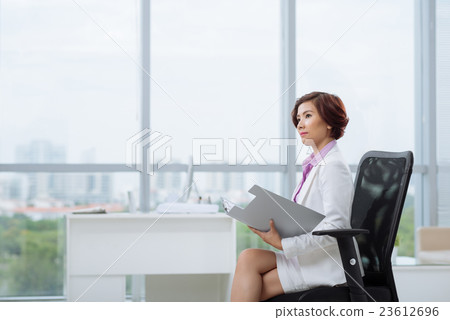 Pensive female entrepreneur Pensive female entrepreneur 23612696