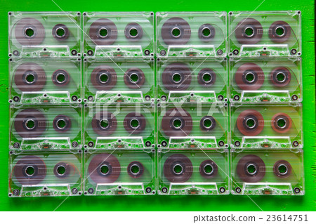 Set of old audio cassettes on wooden table. 23614751