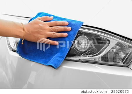 Hand with microfiber cloth cleaning car 23620975