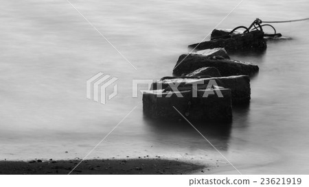 Concrete block in sea with long exposure technique Concrete block in sea with long exposure technique 23621919