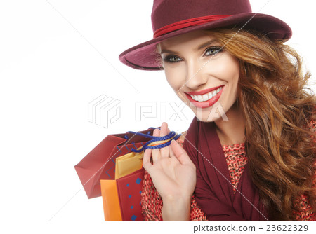 Portrait of young beautiful women with her shopping bags 23622329