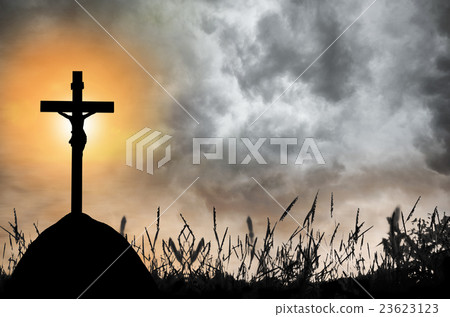 Silhouette the cross over blurred sunset  23623123