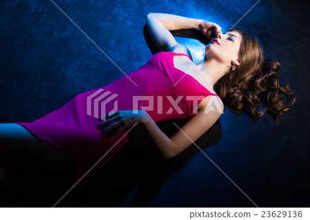 Sensual  brunette girl in pink dress asleep on 23629136