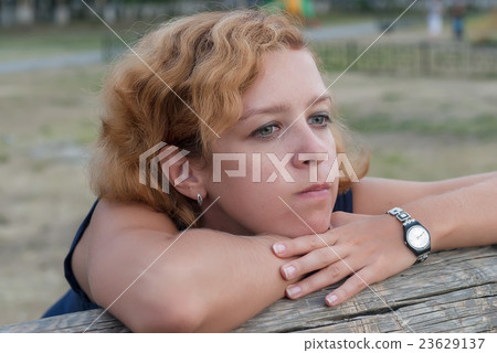 Attractive young blonde woman with freckles 23629137