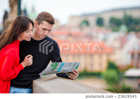 Young tourist couple traveling on holidays in 23629343