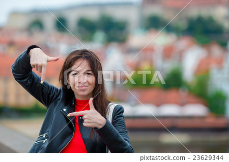 Happy young urban woman in european city Happy young urban woman in european city 23629344
