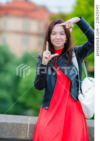Happy young urban woman in european city 23629345