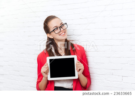 Businesswoman show tablet computer screen with Businesswoman show tablet computer screen with 23633665