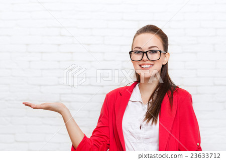 Businesswoman open palm hand gesture to copy space 23633712